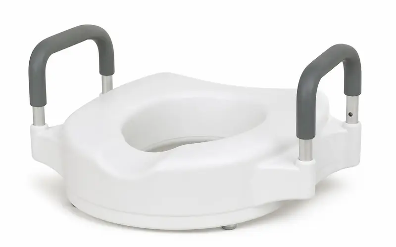 Illustration of a white raised toilet seat with padded grey handles. Shows the type of product, not the exact brand or model.